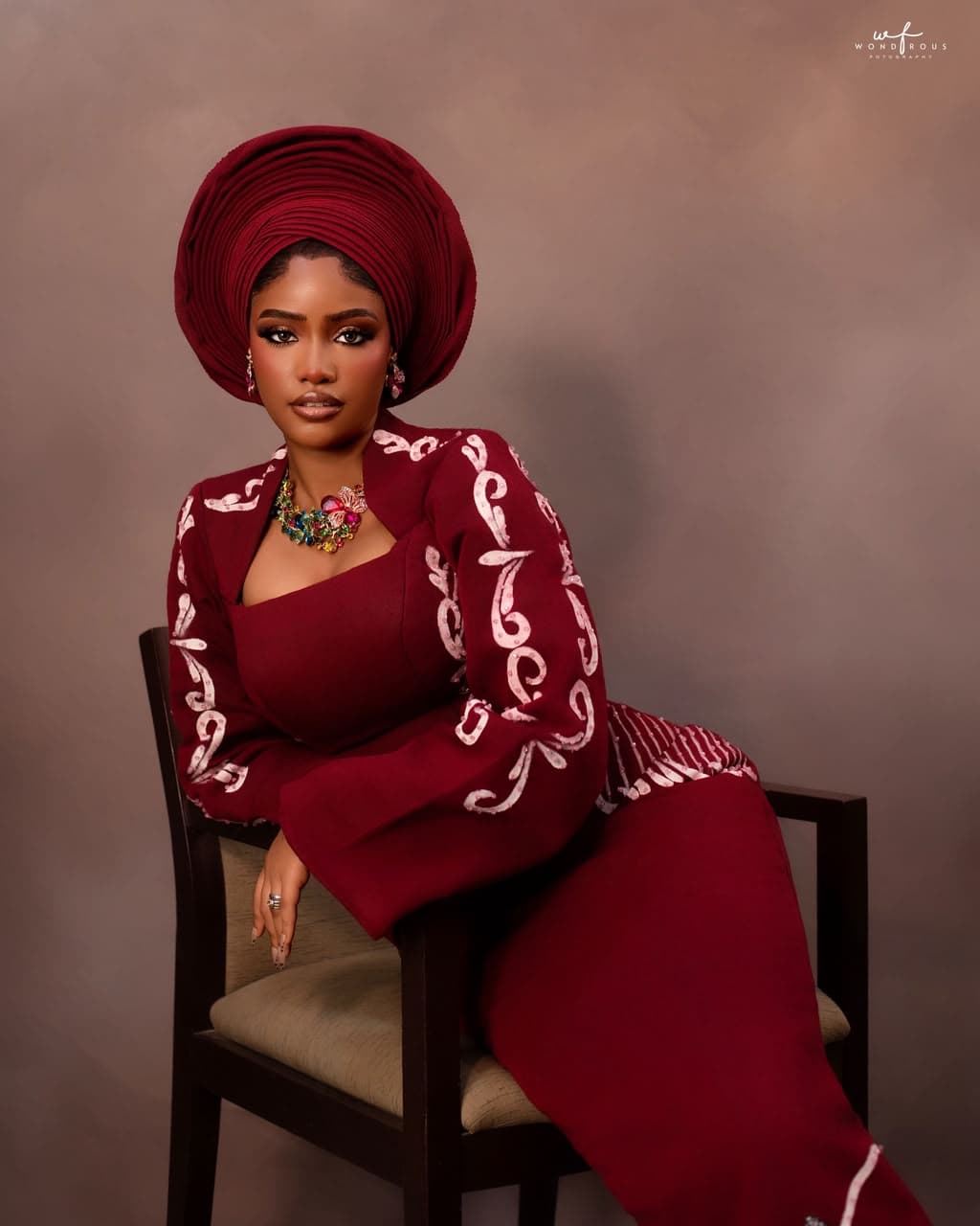 Bride in traditional wine gele and aso-oke bridal look at Hairxpresser.NG