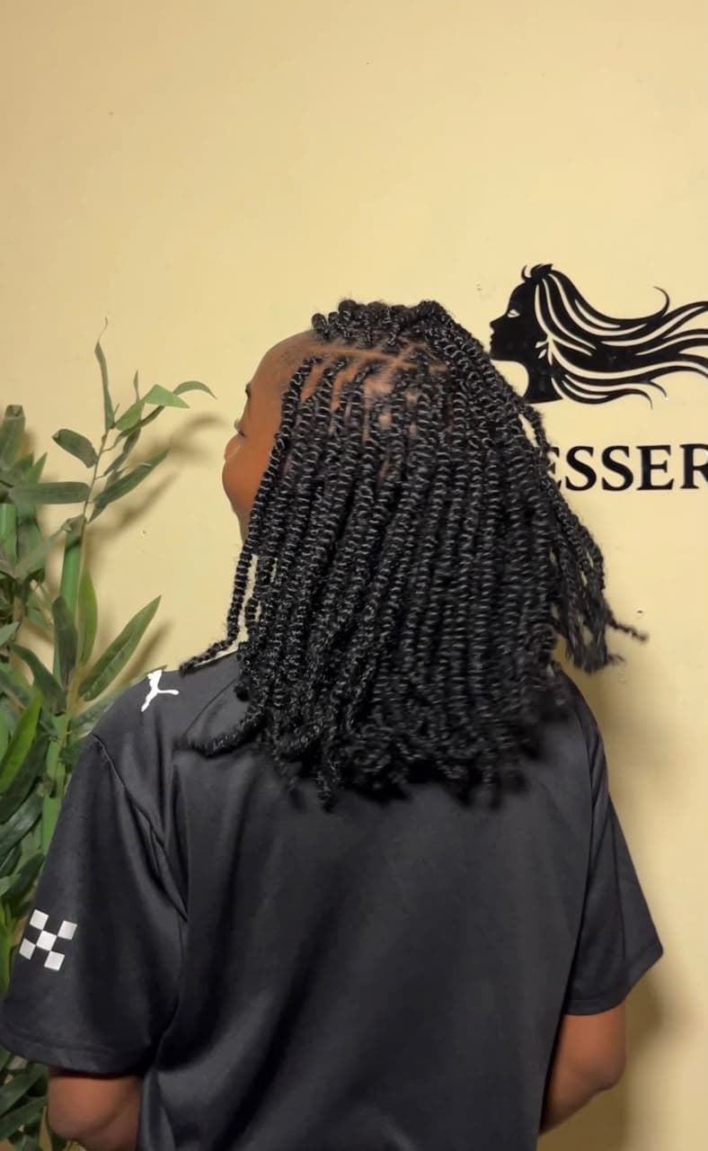 Client with kinky twists hairstyle — back view at Hairxpresser.NG