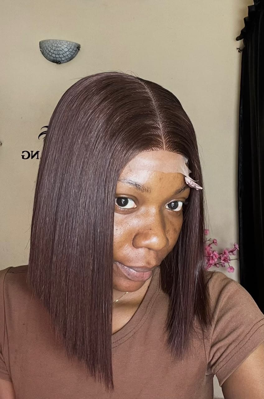 Finished dark plum straight bob wig construction on client