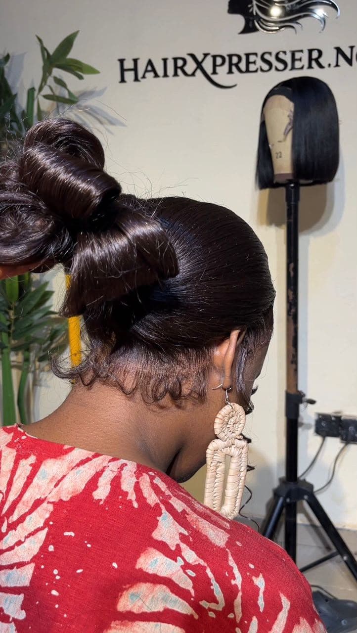 High bun wig installation — back view at Hairxpresser.NG