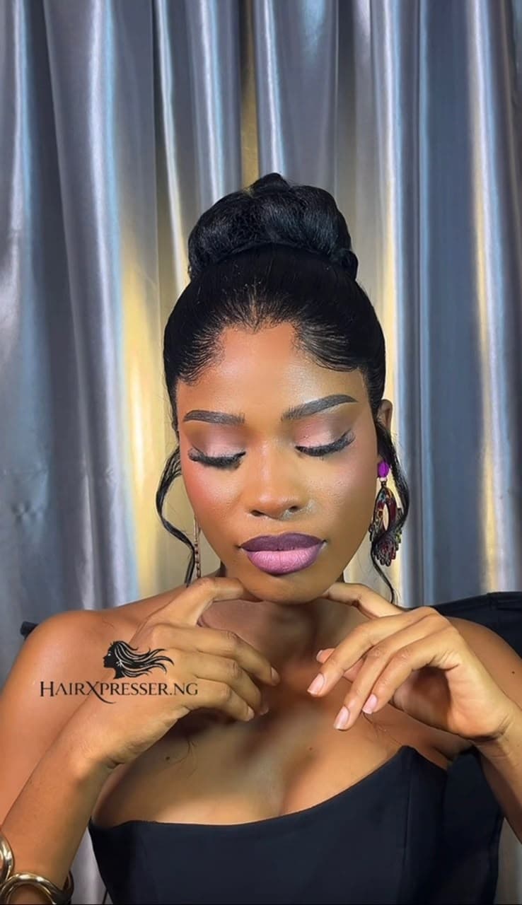 Elegant sleek high bun wig installation at Hairxpresser.NG