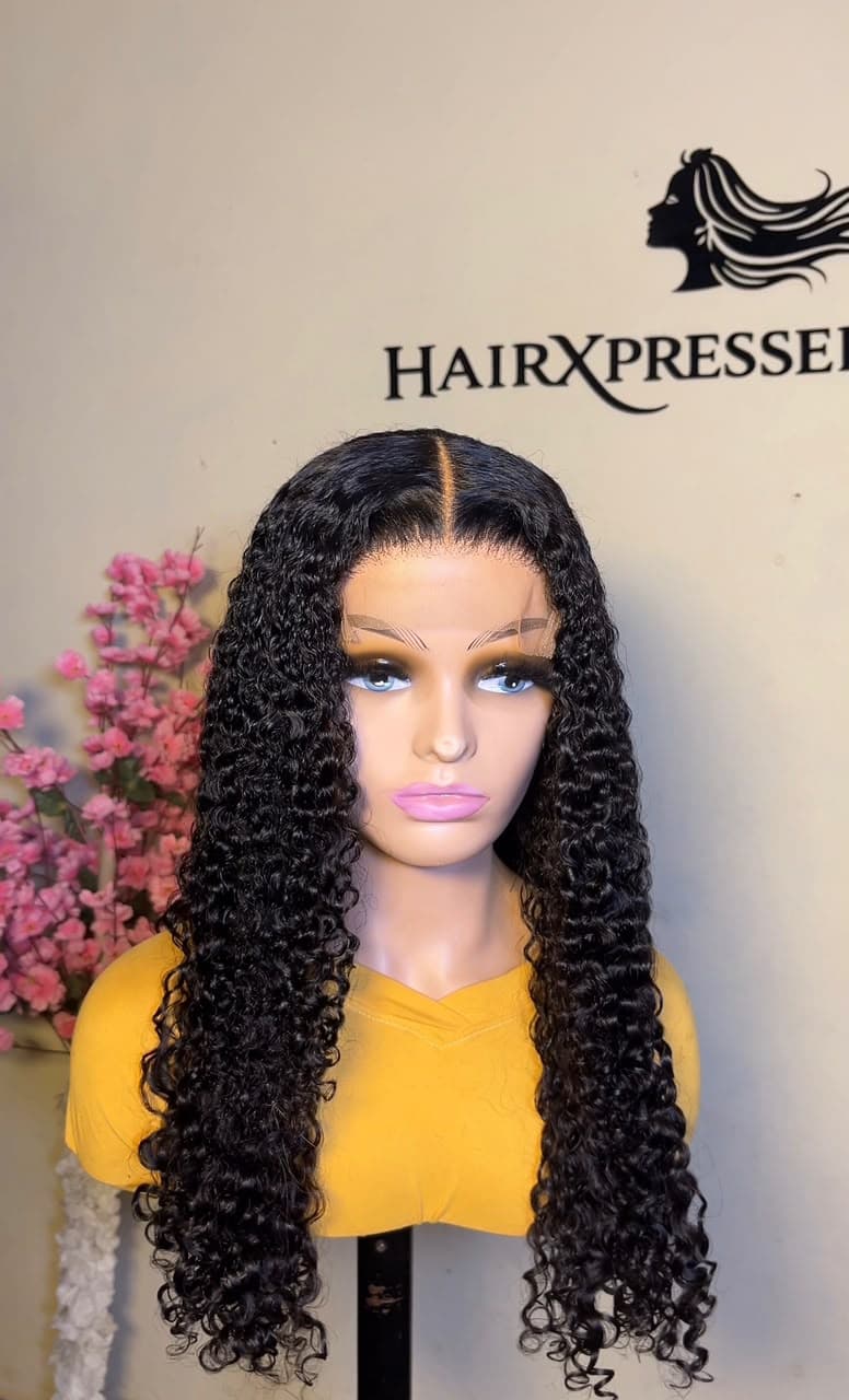 Long black kinky curl lace-front wig styled at Hairxpresser.NG